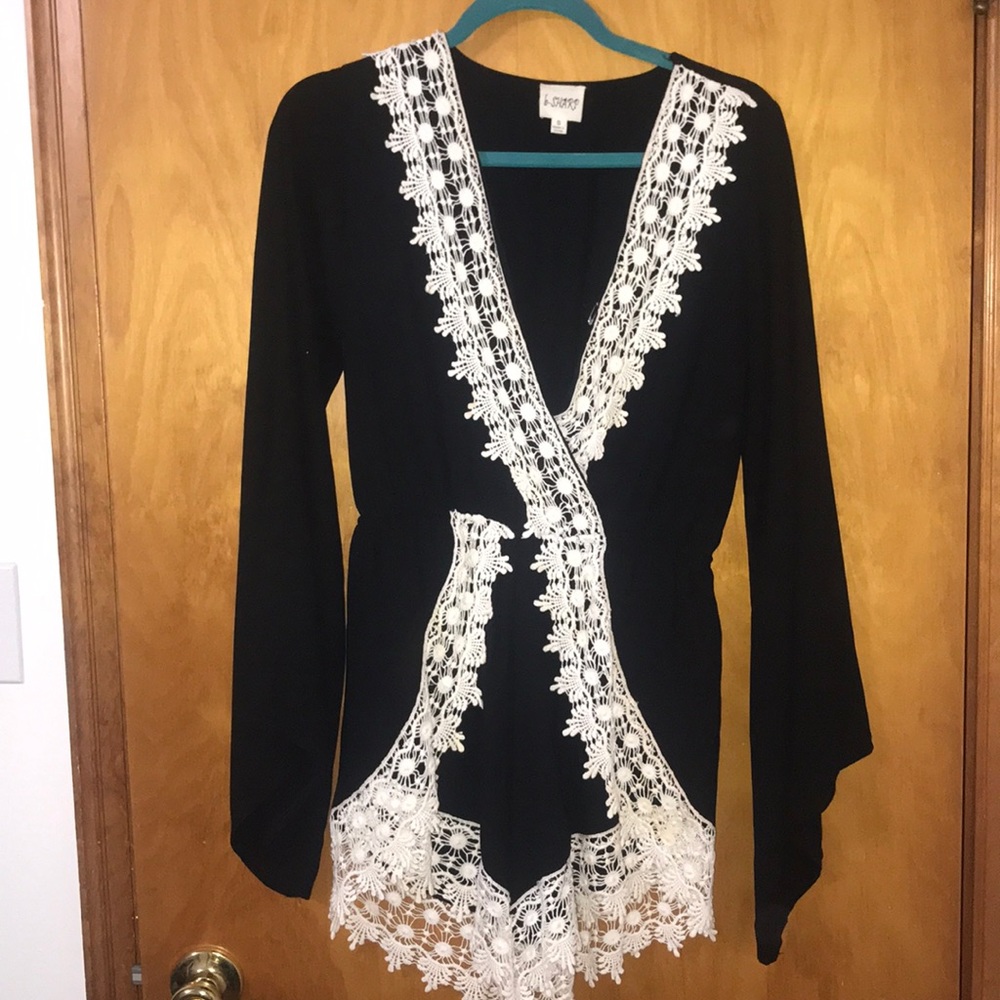 Black romper with white lace trim